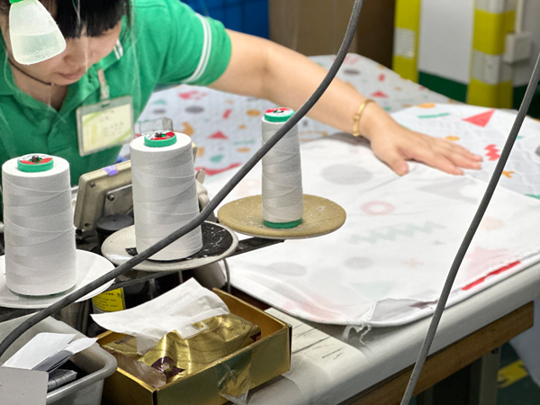 Conni staff working on textile production
